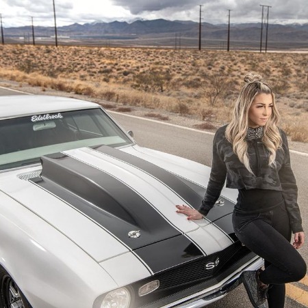Lizzy Musi with her Chevrolet Camaro.